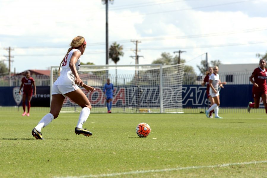 <p>Midfielder Alexa Montgomery (20) pushes the ball down the field to the Stanford goal Sunday, Oct. 4. The Wildcats lost 3-2.</p>