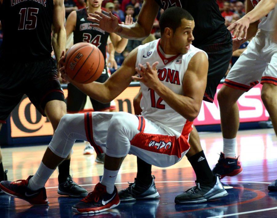 <p>Arizona forward Ryan Anderson (12) gets low while playing against Chico State in McKale Center Sunday, Nov. 8.</p>