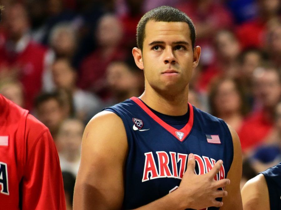 Ryan+Anderson+%2812%29+places+his+hand+over+his+heart+during+the+national+anthem+in+McKale+Center+before+the+Red+Blue+scrimmage+on+Saturday%2C+Oct.+17.