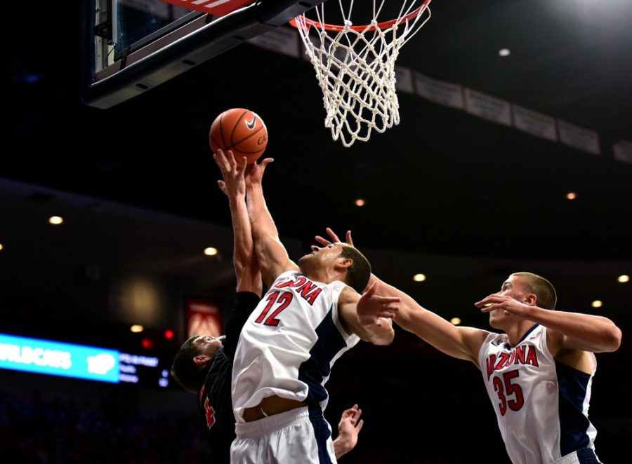 Arizona forward Ryan Anderson (12) hijacks a shot by Pacific during the Wildcats win in McKale Center on Friday, Nov. 13. No. 12 Arizona faces Bradley on Monday, Nov. 16, looking to improve on their opening game performance. 