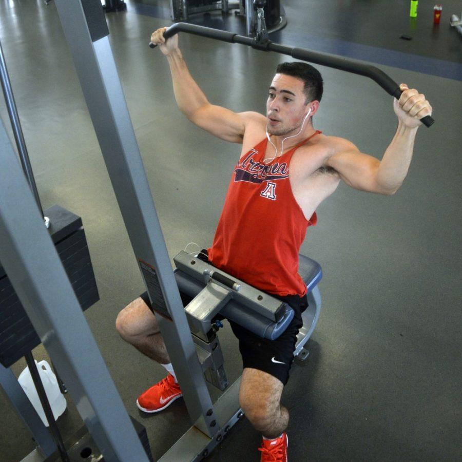 Business management junior Anthony Efaw does a back workout Nov. 5 at the Student Recreation Center. The UA offers many facilities and programs to its faculty and students in an effort to promote healthy lifestyles.