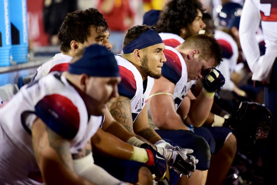 Melancholy members of the Arizona football team sit on the bench during the fourth quarter and watch Arizonas 38-30 loss to USC at Los Angeles Memorial Coliseum on Saturday, Nov. 7. 