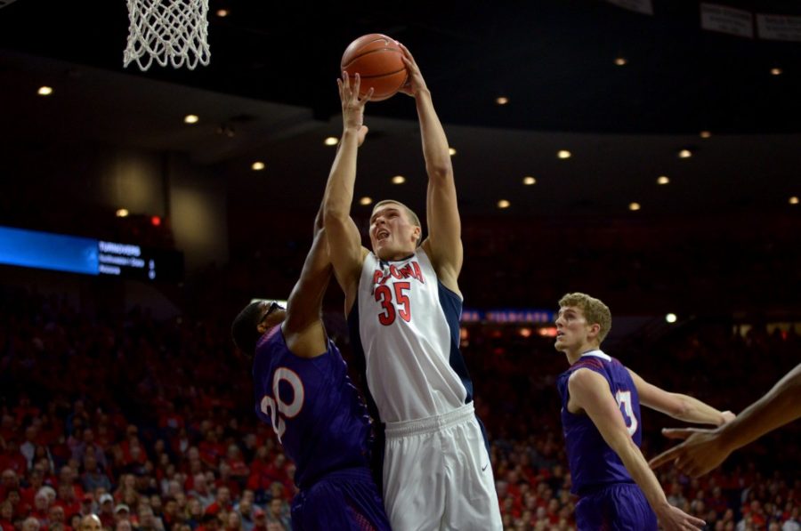 <p>Arizona center Kaleb Tarczewski (35) leaps for a dunk in McKale Center on Sunday, Nov. 22. Tarczewski was averaging eight points and seven rebounds before his injury in the Wooden Legacy.</p>