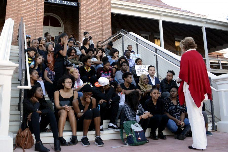 Members of the UA Black Student Union present their grievances to UA President Ann Weaver Hart on the steps of Old Main on Friday, Nov. 13. The students were demonstrating in solidarity with student activists at the University of Missouri.