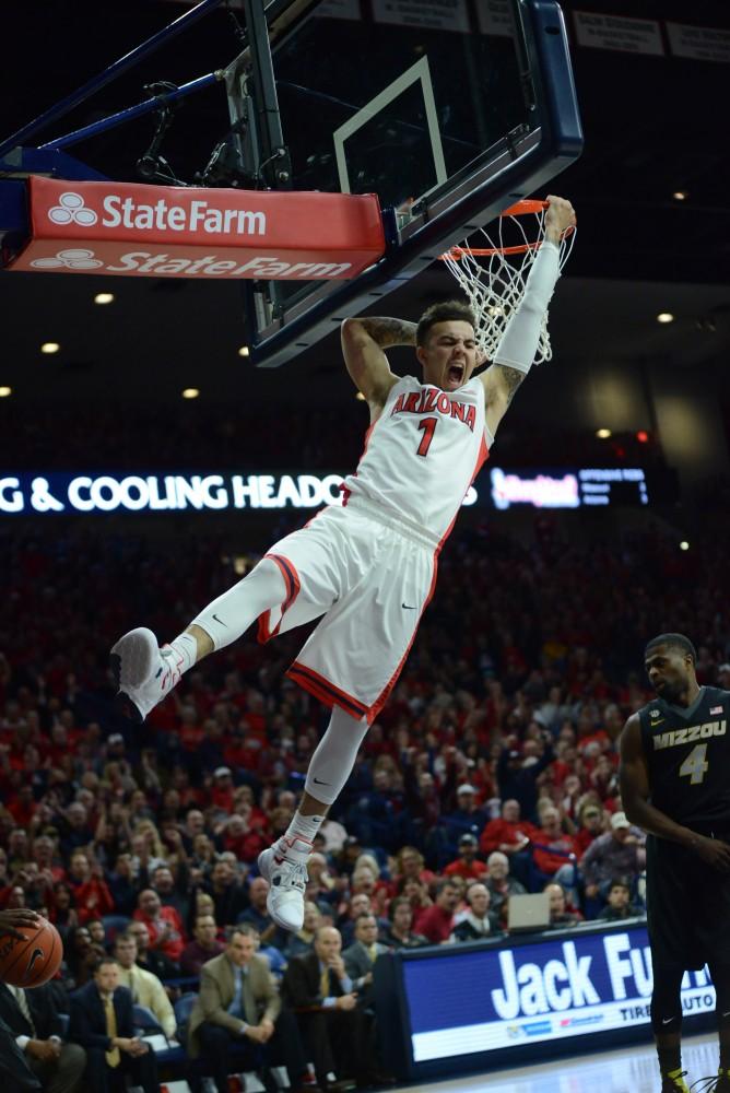 Arizona Wildcat guard Gabe York (1) dunks in epic style in McKale Stadium on Sunday, Dec. 13. The Wildcats are up 42-23 at halftime.