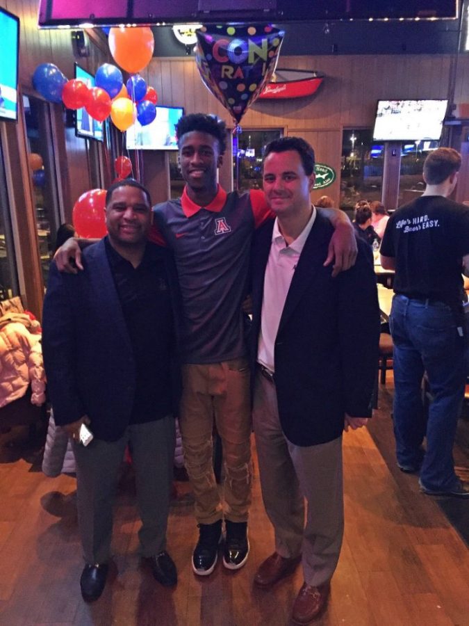 Kobi Simmons, a freshly committed UA basketball recruit, stands with head coach Sean Miller and assistant coach Emanuel Richardson on Sunday, Jan. 17. Simmons captioned the photo Coaches Came To Visit Me Today !
