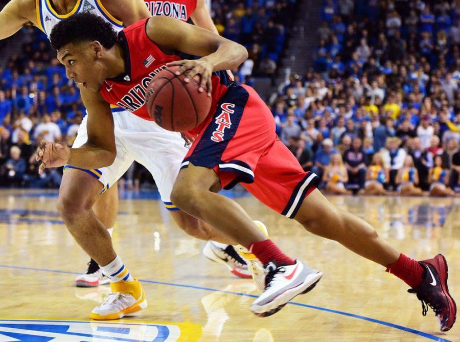 Arizona guard Allonzo Trier (11) powers past UCLA defense for a drive to the basket during UCLAs 43-36 halftime lead over Arizona at Pauley Pavilion in Los Angeles, Calif. on Thursday, Jan. 7.