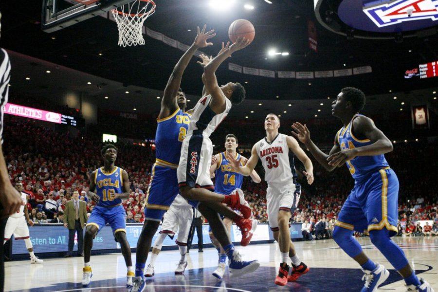 Arizona point guard Parker Jackson-Cartwright (0) jumps to dunk the ball against UCLA on Feb 12 in McKale Center. The Wildcats rallied back in the second half to defeat the Bruins 81-75.