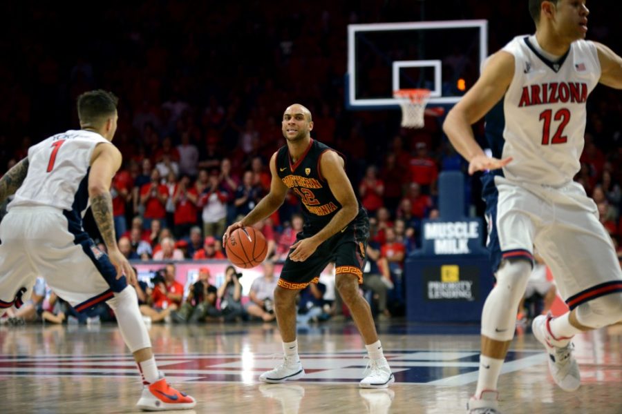 USC guard Julian Jacobs (12) stands prepared to attack the Arizona hoop in McKale Stadium on Sunday, Feb. 12. The Trojans were defeated 86-80.