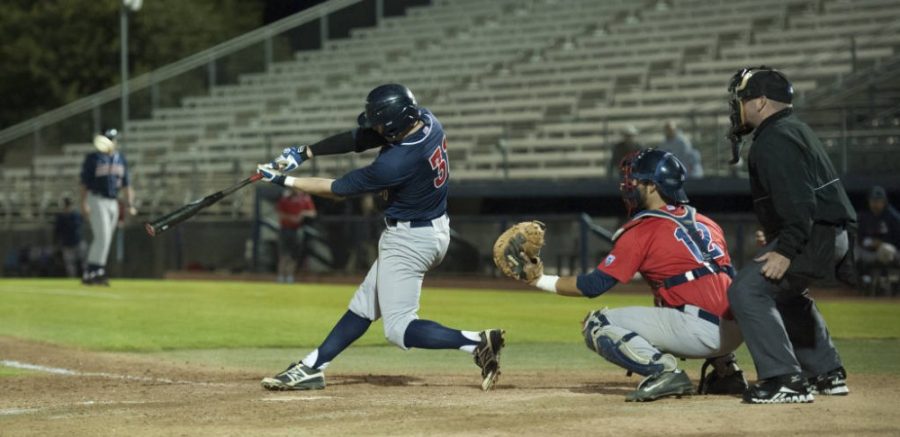Arizona+catcher+Cesar+Salazar+%2812%29+sits+behind+home+plate+on+day+two+of+the+Wild+vs.+Cats+World+Series+on+Nov.+20%2C+2015.
