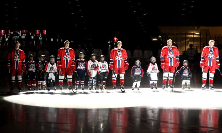 Members of the UA hockey team line up with the AZ Junior Wildcats before playing against ASU on Feb. 19, 2016. The team made it to the second round of the ACHA Men’s Division I National Tournament before falling to Minot State last Friday. 