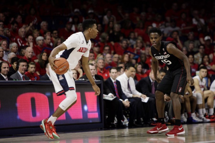 Arizona freshman guard Justin Simon (3) eyes the court during Arizonas 94-62 win against Stanford on Saturday, March 5 in McKale Center. Simon has decided to transfer from Arizona, hoping to get more playing time.