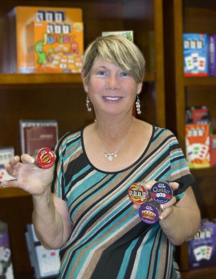 Marsha Falco, founder of Set Enterprises Inc., displays her games. Falco has an educational background in science, which has helped her find business success in the board game industry.