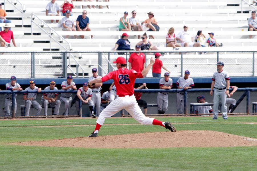 Arizona pitcher Michael Flynn (26) pitches at Hi Corbett field on Sunday, March. 6. Flynn allowed three earned runs during four innings. 