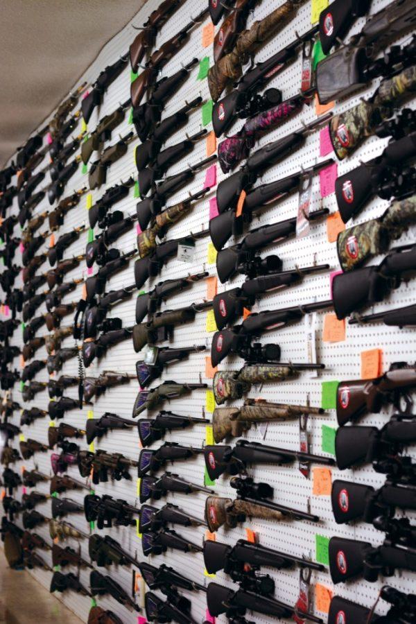 A variety of guns on display at Second Amendment Sports on Pima Street in Tucson. Firearm identification, background checks on firearm purchases and background checks on ammunition have observed to reduce gun related fatalities.