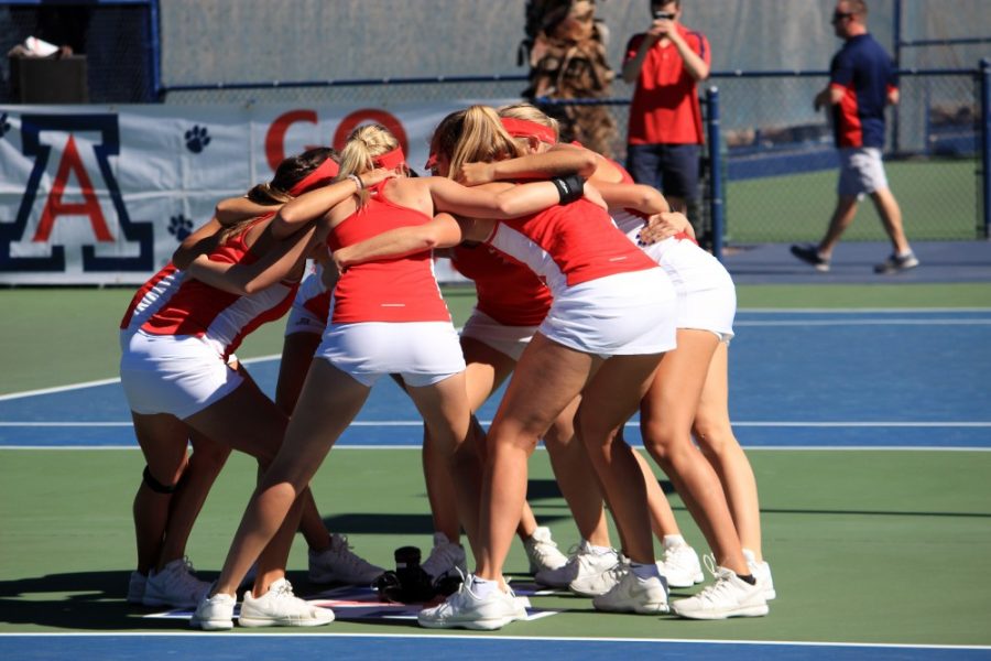 Arizona womens tennis athletes huddle up before a match against the University of San Diego on Feb. 12 in Tucson. Arizona defeated Tulane 6-1 on Feb. 27.