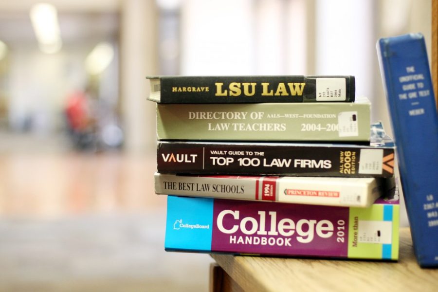 Law textbooks on a shelf in the Main Library on March 4. After a study conducted in conjuction with the Educational Testing Service, the UA James E. Rogers College of Law will now be accepting Graduate Record Examination scores alone for law school admissions. 