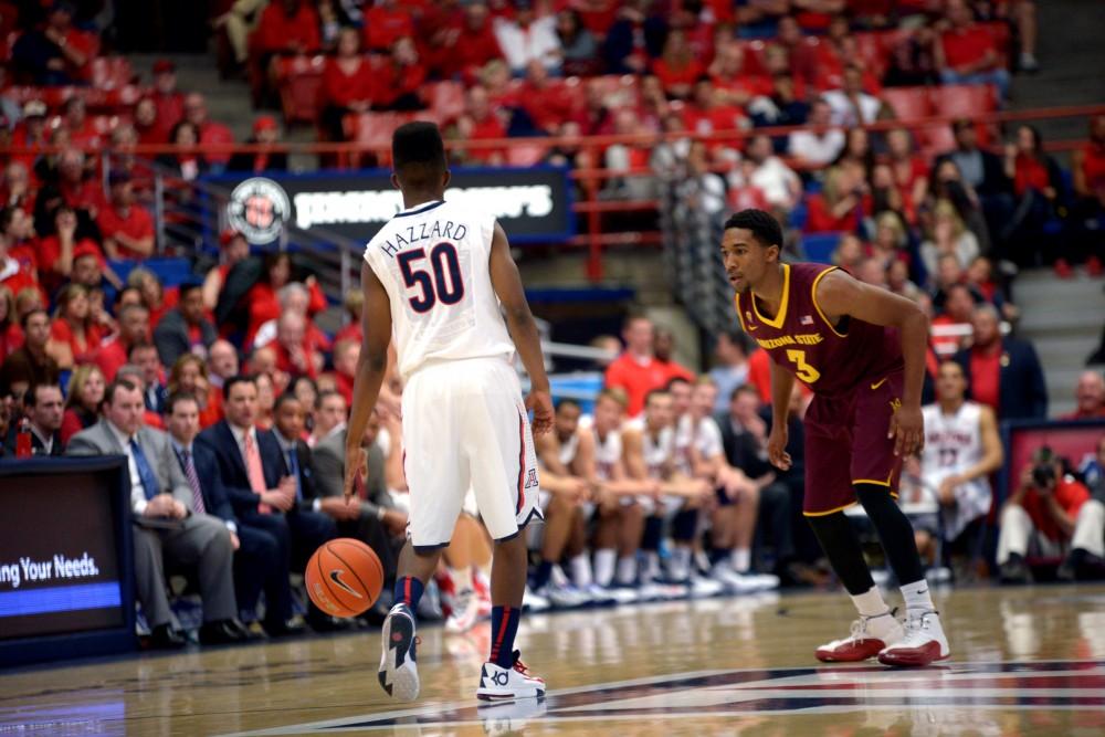 Arizona guard Jacob Hazzard (50) brings the ball down court at the end of the game against ASU in McKale Center on Jan 23, 2014.