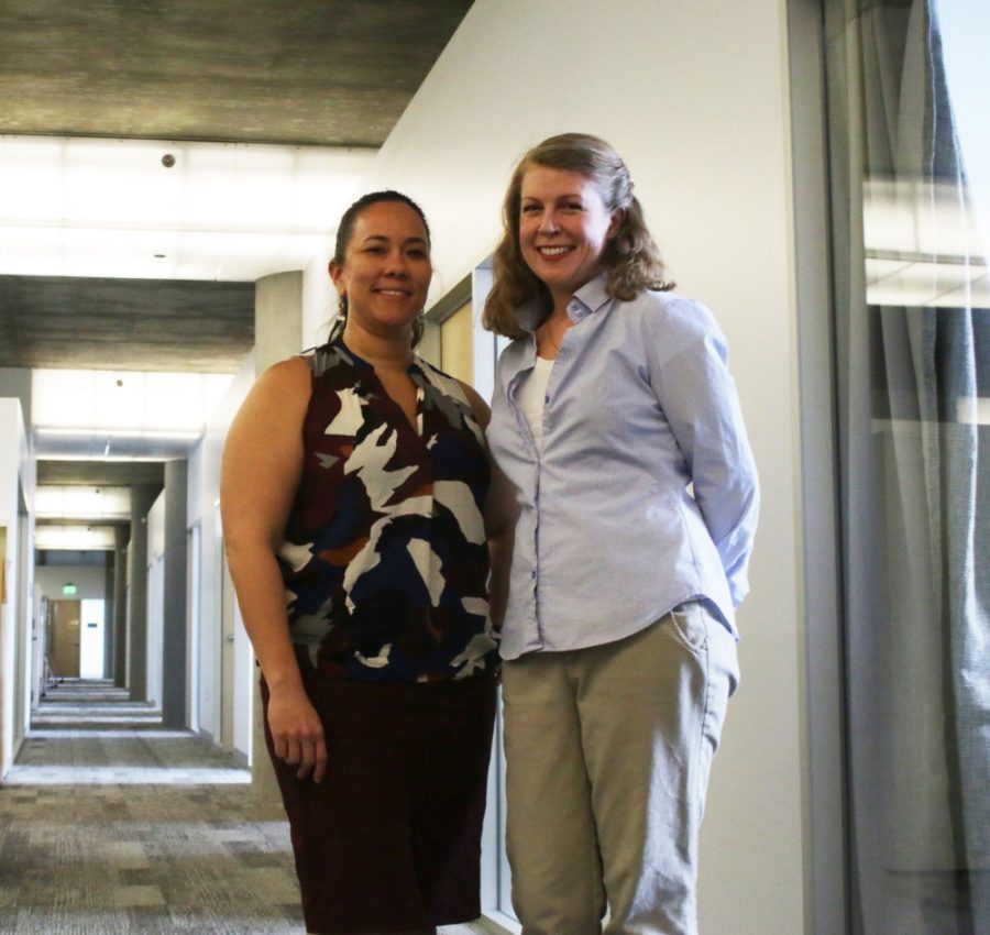 Dr. Rebecca McGraw and Dr. Jennifer Eli pose for a photo in the ENR2 building. Both women research math education at the UA.