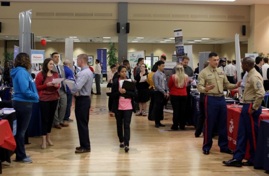 Students file through rows of recruiters during the Spring Career Fair at the Student Union Memorial Center on Tuesday, March 8. The fair is the most popular event that Career Services puts on every year. 