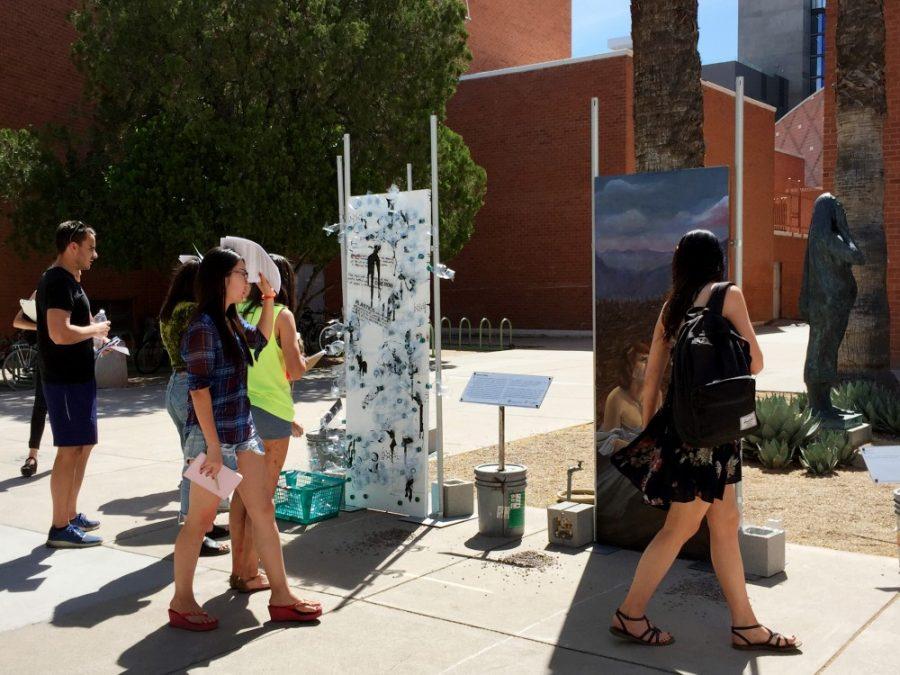 UA students view artwork in “Opening Doors” exhibit at the UAMA on Earth day. Students for Sustainability partnered with the UAMA and other organizations for the “Opening Doors” ecological art project that will run until the end of the school year.