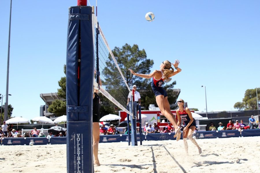 Arizona sand volleyball athlete McKenna Witt jumps to spike the ball during Arizona’s 5-0 victory over California State Northridge on Saturday, March 26.