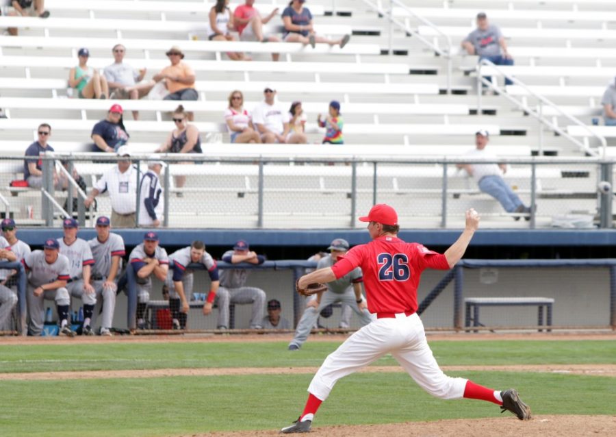 Arizona pitcher Michael Flynn (26) pitches at Hi Corbett Field against St. Marys on Sunday, March 6. The UA won two of three games against Washington State over the weekend.