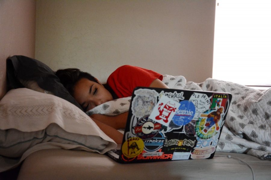 Paloma Colacion, an architecture sophomore, lounges in bed while watching Netflix on Thursday, April 28, 2016.