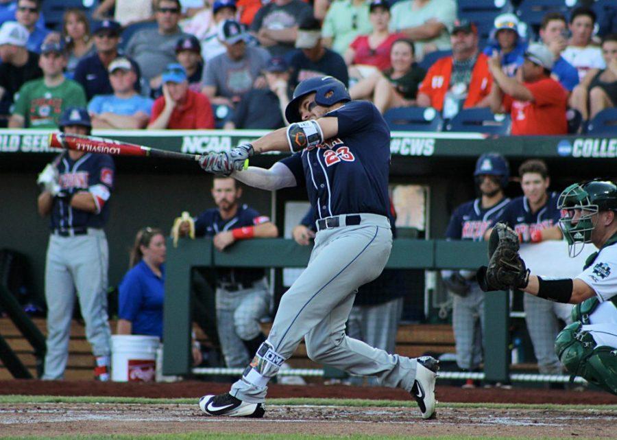 Arizona outfielder Zach Gibbons swings for the pitch against Miami at the NCAA World Series in Omaha, Nebraska. 