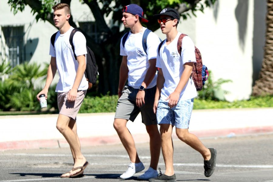 Engineering sophomores and PIKE fraternity members Jared Dolby, Scooter Bankofier,and Christian Pappas walk to their classes on Monday, August 29.