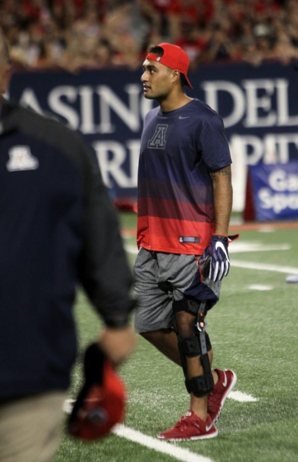 Arizona quarterback Anu Solomon (12) walks on the fireld with an injured knee in Saturdays game against Grambling State. Solomon has started 26 games for the Wildcats during his time at Arizona.