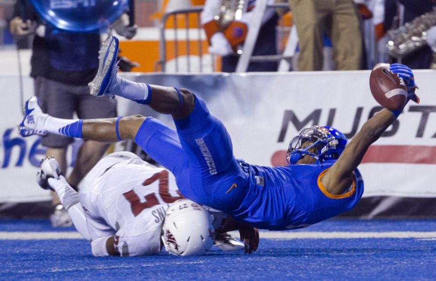 Boise State wide receiver Cedrick Wilson (1) hauls in a long pass against Washington States Marcellus Pippins (27) late in the second quarter to set up a field goal and a 17-7 lead at the end of the first half on Saturday, Sept. 10, 2016, at Albertsons Stadium in Boise, Idaho. 