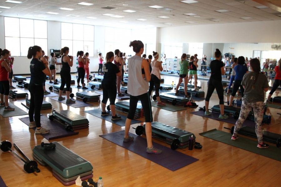 Students work out in the Student Recreation Centers group fitness class Body Pump on March 2. The Rec Center offers a plethora of group fitness classes every day of the week. 