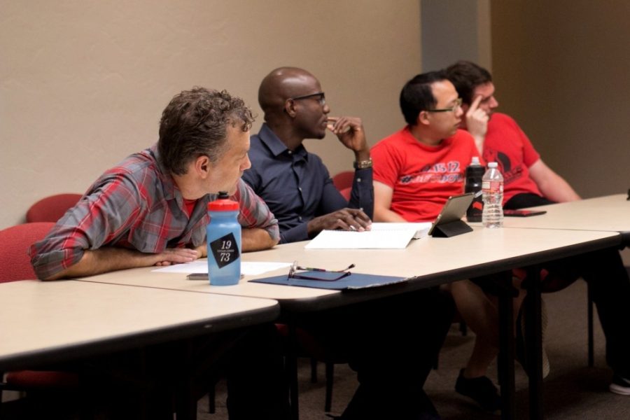 (From left to right) Zachary Brooks, Jude Udeozor, Wei-Ren Ng and Ezra Smith listen during discussion at the Graduate and Professional Student Council meeting in the Pima room at the Student Union Memorial Center on Thursday, Aug. 25. Udeozor will be stepping in as GPSC president after Brooks resignation goes into effect.