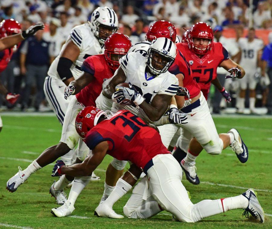 Arizona+linebacker+DeAndre+Miller+%2832%29+sends+BYU+offense+for+a+tumble+during+Arizonas+18-16+loss+to+BYU+in+the+Cactus+Kickoff+Classic+at+the+University+of+Phoenix+Stadium+on+Saturday%2C+Sept.+3.