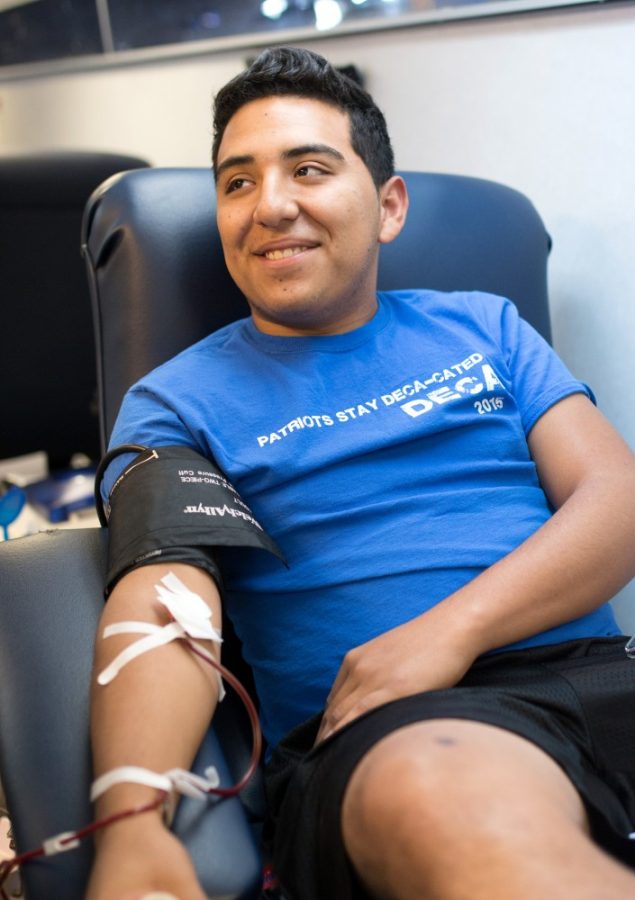Francisco+Vasquez%2C+a+freshman+pre-business+student%2C+donates+plasma+on+Highland+Avenue+on+Tuesday%2C+Sept.+13.+Vasquez+donates+as+often+as+he+can+in+the+memory+of+his+grandfather%2C+who+suffered+from+Leukemia.