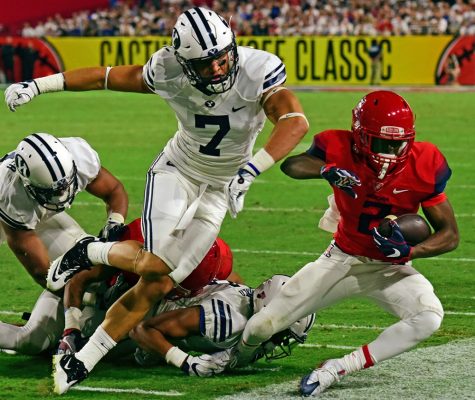 BYU defensive back Micah Hannemann (7) knocks Arizona wide receiver Tyrell Johnson (2) out of bounds during Arizona's 18-16 loss to BYU in the Cactus Kickoff Classic at the University of Phoenix Stadium on Saturday, Sept. 3.
