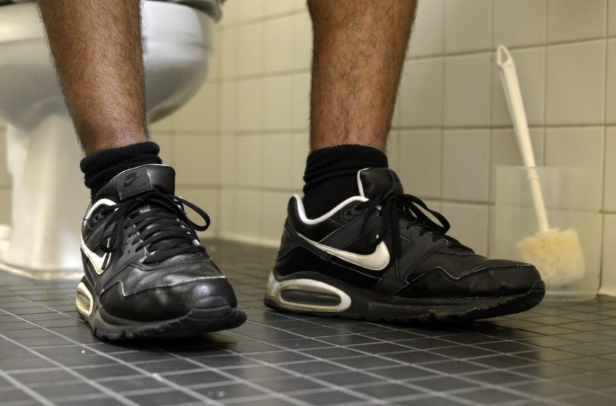 A view of some shoes as they touch the bathroom floor on Tuesday morning. UA researches recently conducted research that showed just how many germs end up on the bottom of our shoes.