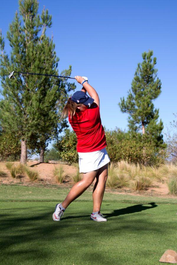 Arizona golf athlete Haley Moore follows through on her swing at a practice on Wednesday, Oct. 19.