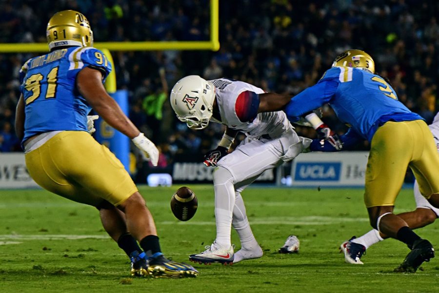 Arizona receiver Shun Brown (6) fumbles the ball shortly before making a quick recovery as Arizona trails UCLA 14-7 in the first half at the Rose Bowl Stadium in Pasadena, Calif. on Saturday, Oct. 1, 2016. 