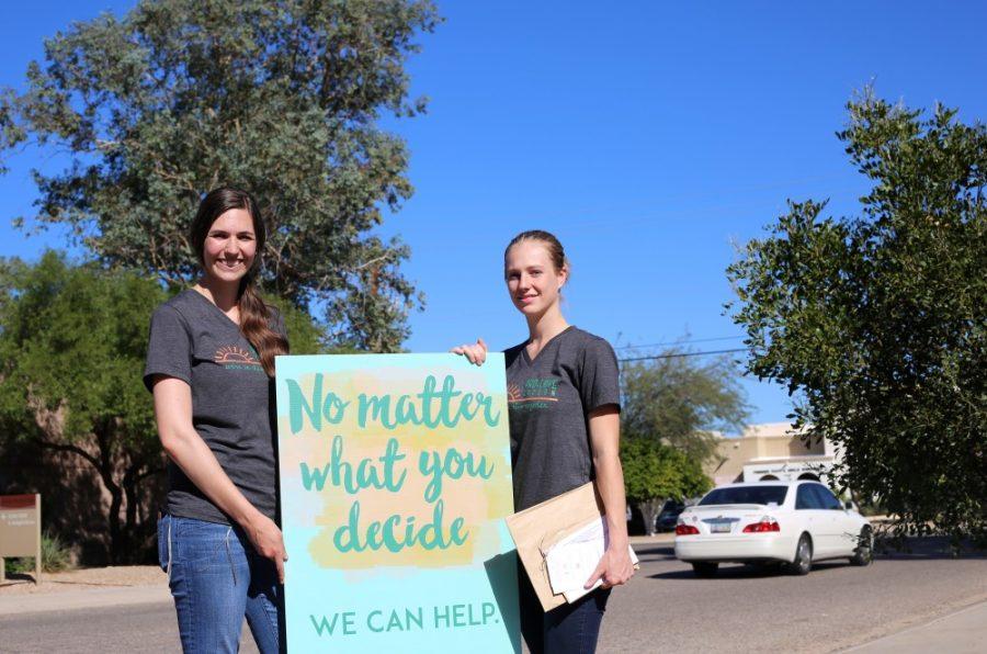 Two anonymous Pro-love Tucson advocates handing out informational pamphlets outside the Tucson Womens Center. Pro-love Tucson is a neutral group falling between Pro-life and Pro-choice, who only want to help women make an informed decision when considering abortion, and giving any support women going through this difficult time need. During the third presidential debate, Donald Trump made several troubling comments on late term abortion and brought the issue back into the national dialog.