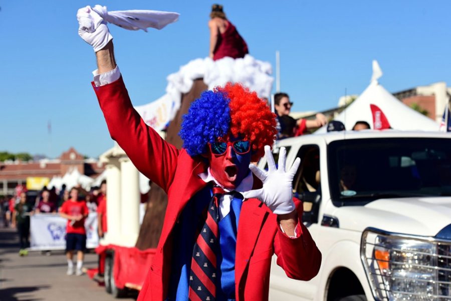 Participant in UAs 101st Homecoming Parade Oct. 24, 2015 shows off his Wildcat pride. The consumption of alcohol marks one of the biggest differences between high school and university Homecoming.