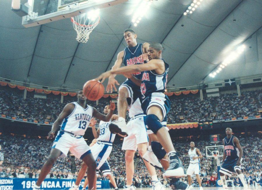 Arizona forwards A.J. Bramlett, left, and Eugene Edgerson go after a loose ball in the 1997 National Championship against Kentucky in Indianapolis. Arizona defeated three No. 1 seeds in the 1997 NCAA Tournament, including Kentucky.
