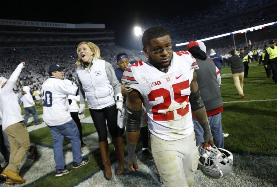 Ohio State running back Mike Weber (25) walks off the field as Penn State fans celebrate a 24-21 win against the Buckeyes on Saturday, Oct. 22, 2016, at Beaver Stadium in State College, Pa. (Adam Cairns/Columbus Dispatch/TNS)