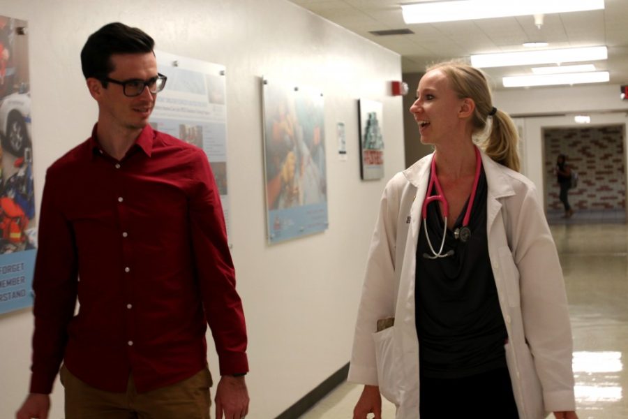 Third-year medical students Samantha Kops and Zechariah Franks walk to a lecture in the UA College of Medicine on Wednesday, Oct. 12. The college was recently honored with INSIGHT Into Diversity Magazine’s 2016 Health Professions High Education Excellence in Diversity (HEED) Award.