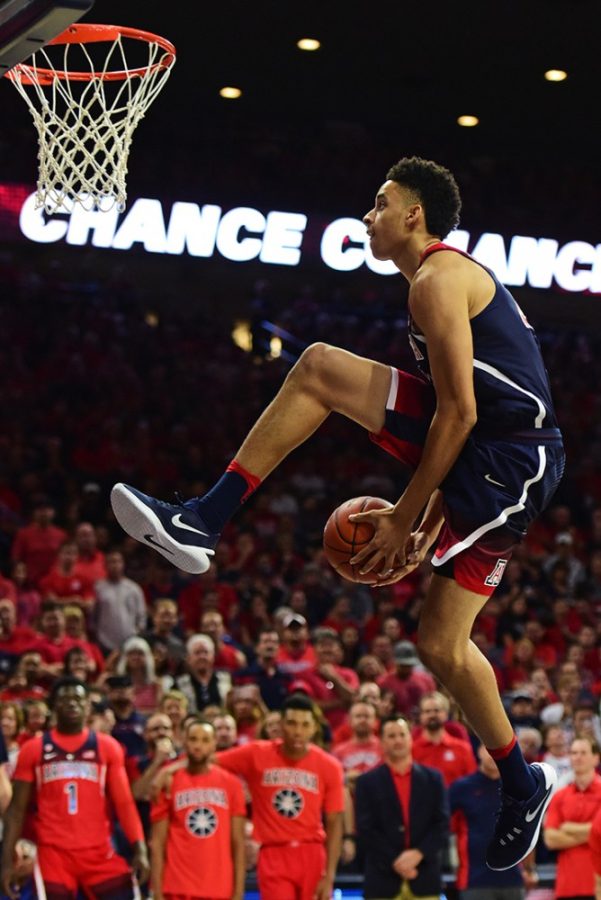 Arizona center Chance Comanche leaps towards the basket in the slam dunk competition before the red and blue scrimmage at McKale Center on Friday, Oct. 14, 2016. 