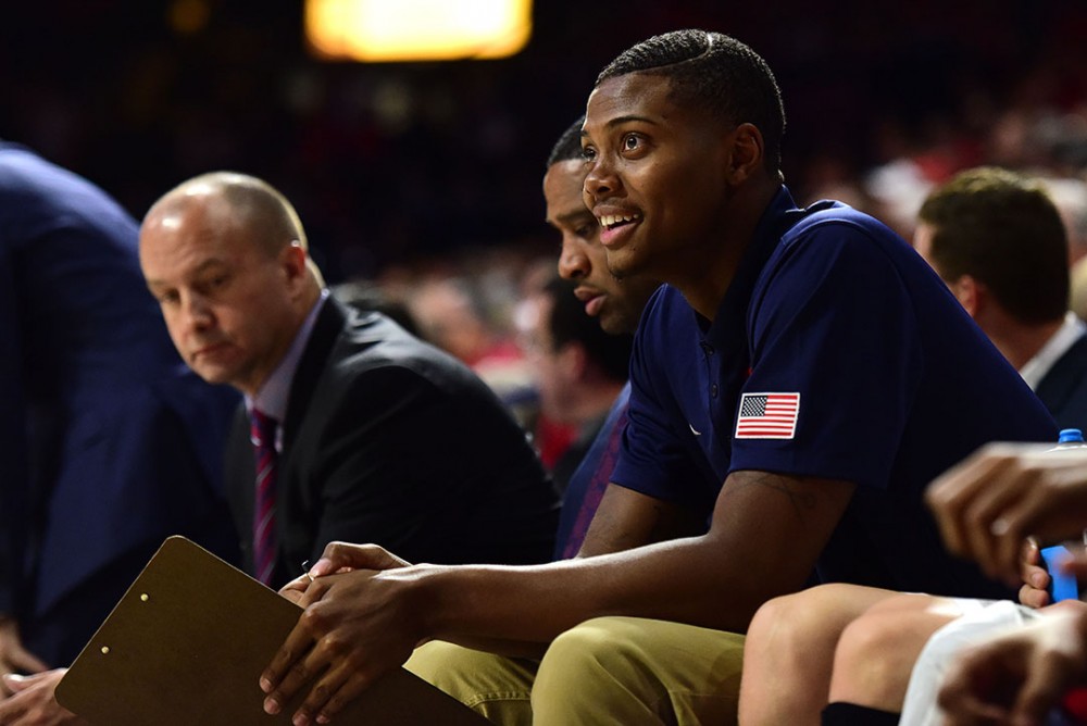 Former Arizona forward Ray Smith smiles from the bench during Arizona's 78-66 win over CSUB at McKale Center on Tuesday, Nov. 15, 2016.