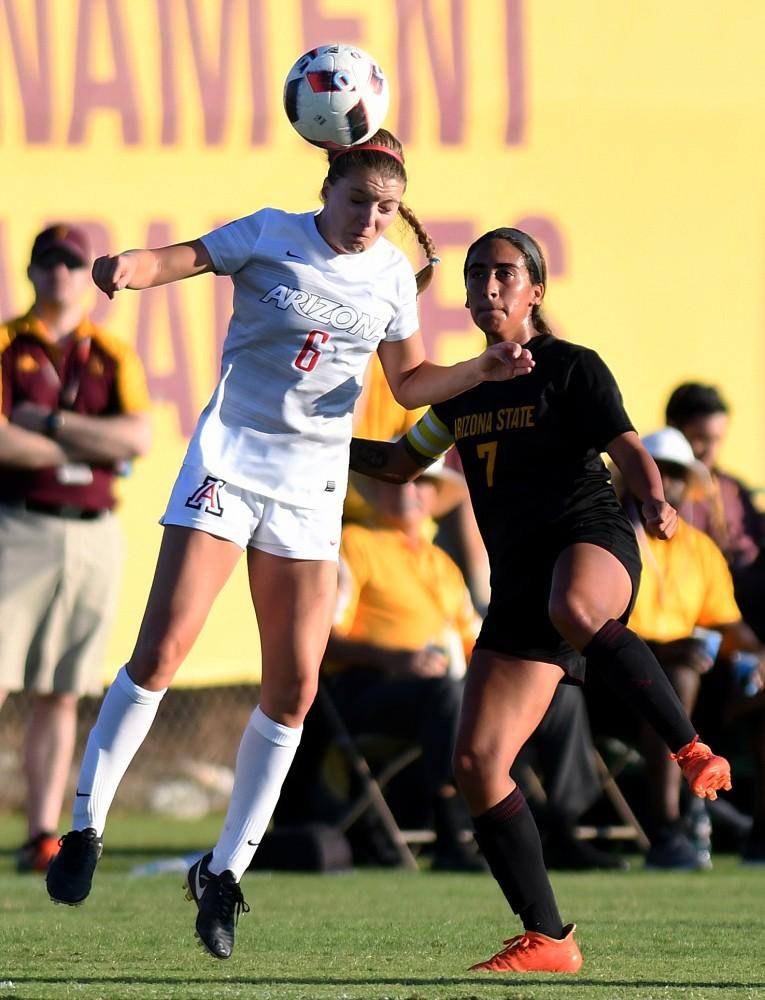 Arizona midfielder Kelcey Cavarra (6) manages to head the ball before ASU midfielder Lucy Lara (7) can get airborne at Sun Devil Soccer Stadium in Tempe on Friday, Nov. 4, 2016. The Wildcats shut out the Sun Devils 1-0 for their first Territorial Cup win in soccer since 2013.