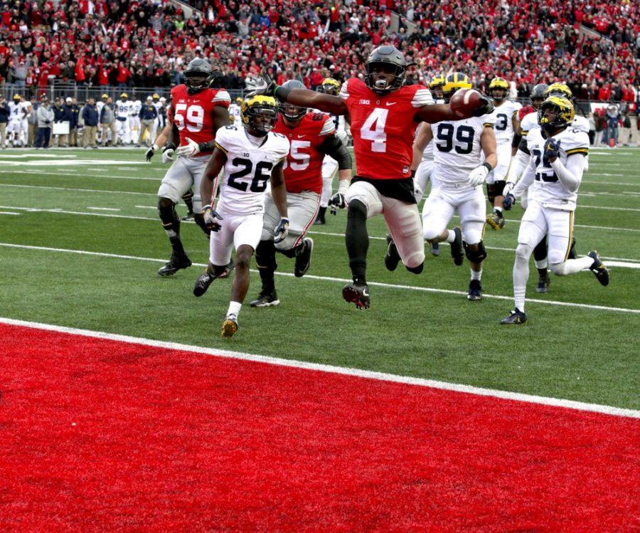 Ohio State’s Curtis Samuel (4) jumps for joy and into the end zone in the second overtime to clinch a 30-27 win against Michigan at Ohio Stadium in Columbus, Ohio, on Saturday, Nov. 26, 2016. (Eric Seals/Detroit Free Press/TNS)