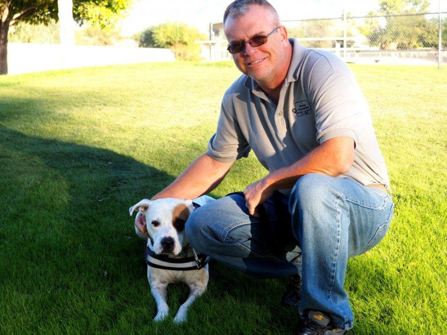David Rufas, chairman of the 1 Veteran Foundation, poses with his dog Menifa at a park in North Tucson on Saturday, Nov. 12.